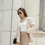 Beautiful woman in stylish beige outfit outdoor