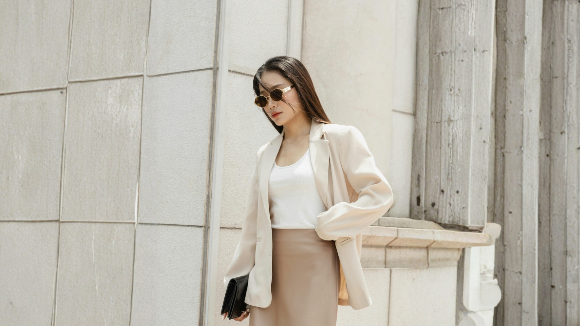 Beautiful woman in stylish beige outfit outdoor