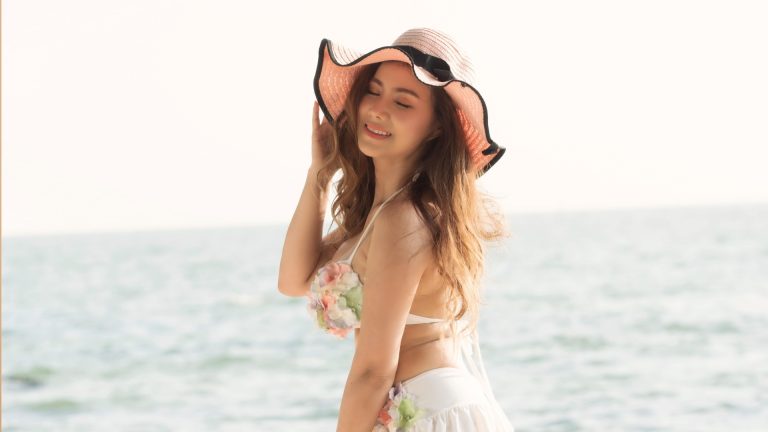 Beautiful woman at the beach in the summer season